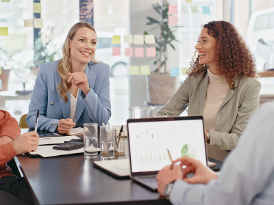 Happy-work-team-collaborating-in-meeting-breaking-down-silos 1